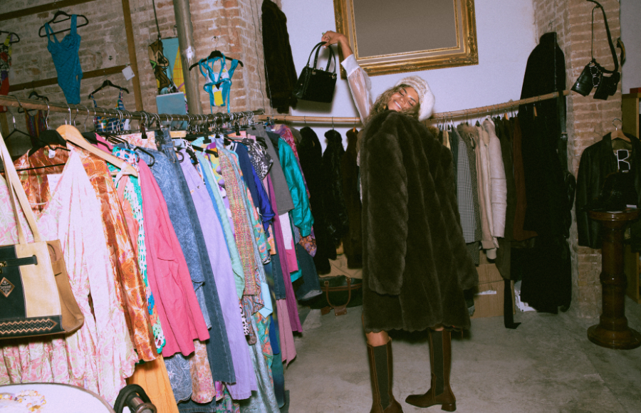 Thrift store women celebrating her coat find