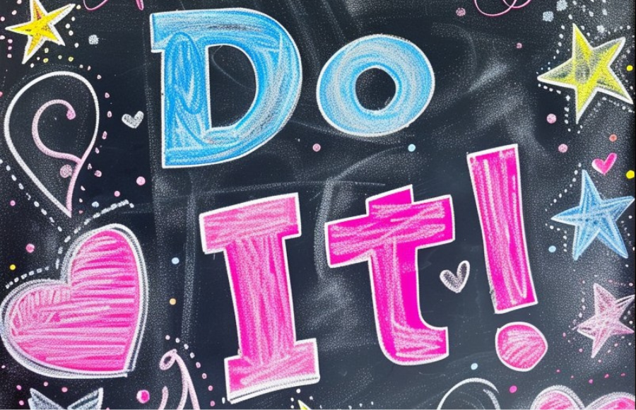 The words DO IT on a chalkboard surrounded by stars and hearts