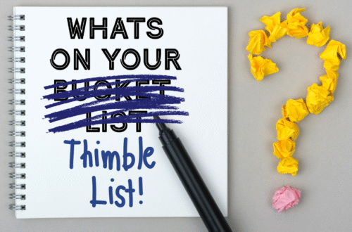 Notepad with What's on your bucket list, but bucket list is crossed out and Thimble List! is added. Yellow question mark to the right of the pen.