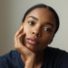 Beautiful Black woman head to the side contemplating