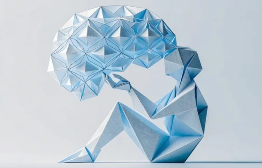 Icy blue oragami image of woman sitting with what looks like a thought bubble