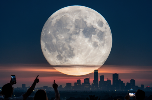 Enormous, stunning moon floating over a cityscape, hints of amber and moody blue colors with shadowy hands of people pointing to it's beauty