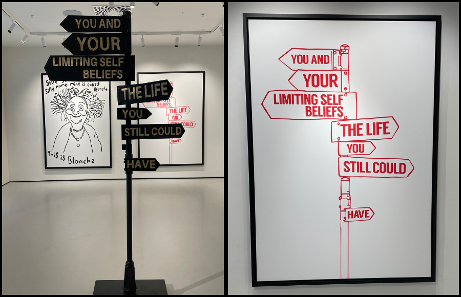 MOCO sign art work - left pointing posts read: 'You and Your Limiting Self Beliefs. Right pointing posts read: The Life You Could Still Have.