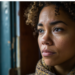 Beautiful black woman, looking out of a window, worried expression, contemplating life, choices, being misjudged.