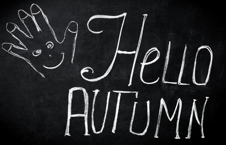 IreneB of SincerelyIreneB, October walk, chalkboard sign with a chalk hand with a smiling face in the palm and the words 'Hello Autumn'.