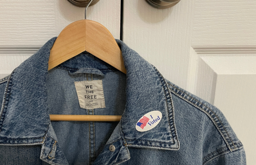 SincerelyIreneb, Vote, November midterms 2026,top part of a denim jacket with an 'I Voted' sticker on the collar, denim jacket brand label reads 'We The Free'.